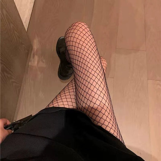 The thin black fishnet stockings with medium-sized mesh for women are alluring.