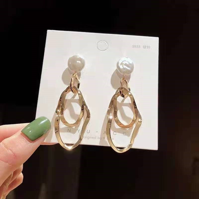 Golden earrings shiny earrings stylish look