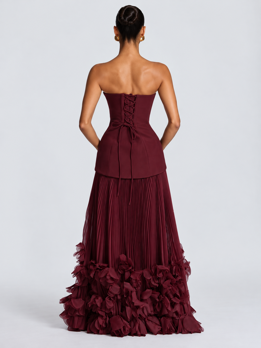 Women's Burgundy Strapless Evening Gown with Structured Corset-Inspired Bodice, Fitted Waist, Voluminous Pleated Tulle Maxi Skirt & Dramatic 3D Floral Appliqué Hemline