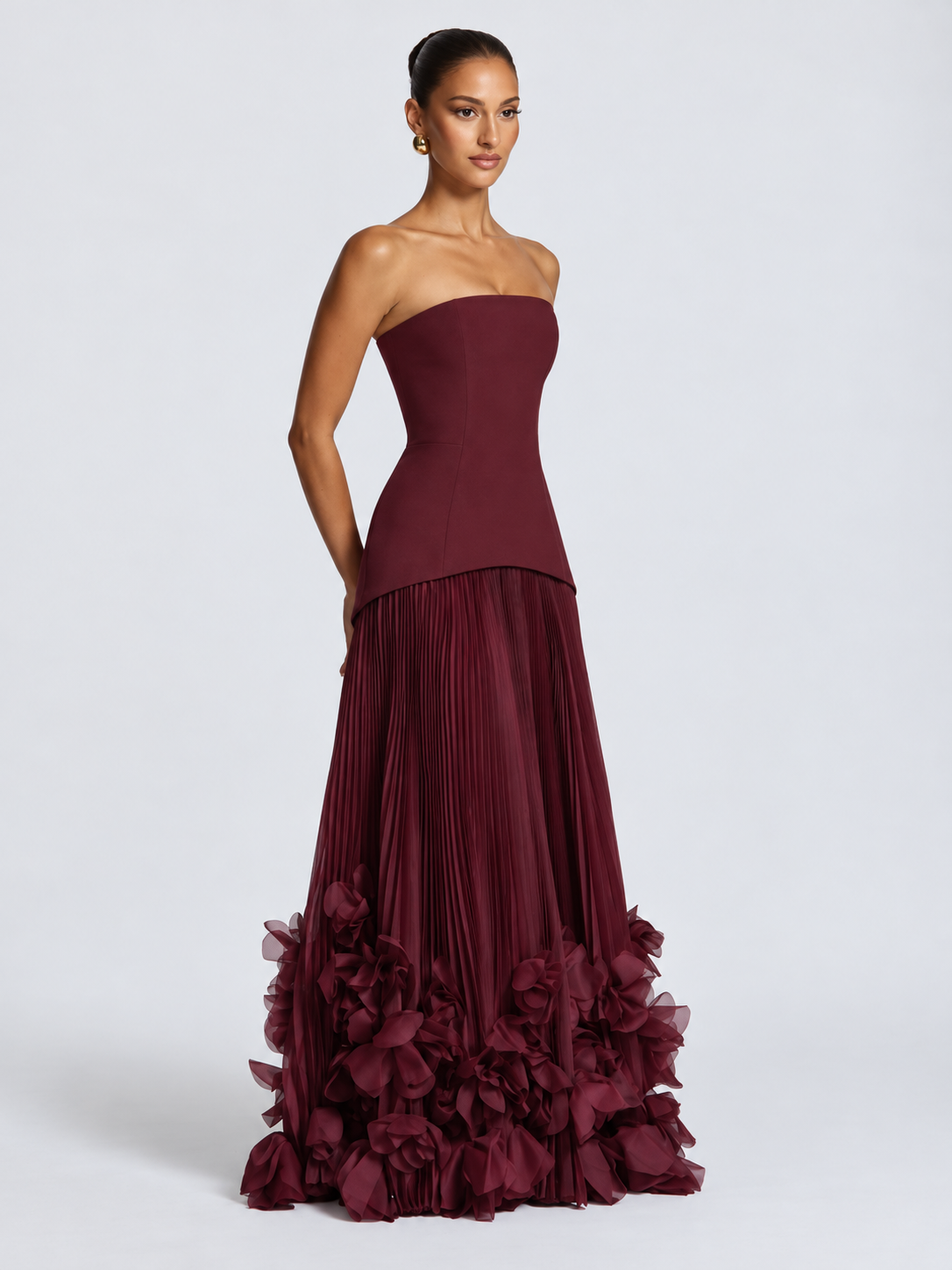 Women's Burgundy Strapless Evening Gown with Structured Corset-Inspired Bodice, Fitted Waist, Voluminous Pleated Tulle Maxi Skirt & Dramatic 3D Floral Appliqué Hemline