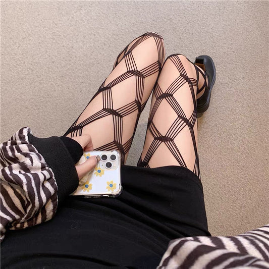 The thin black fishnet stockings with medium-sized mesh for women are alluring.