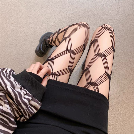 The thin black fishnet stockings with medium-sized mesh for women are alluring.