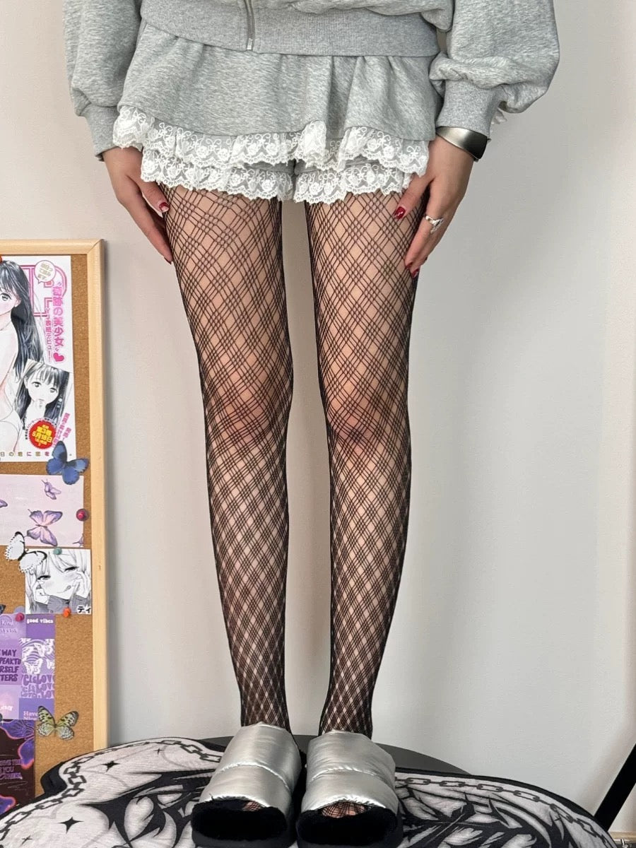 The thin black fishnet stockings with medium-sized mesh for women are alluring.